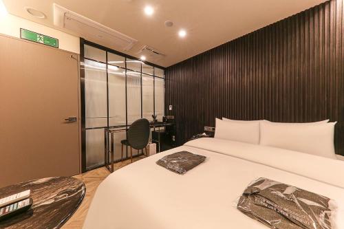 Krevet ili kreveti u jedinici u okviru objekta Heritage31 Hotel