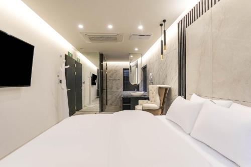 Lova arba lovos apgyvendinimo įstaigoje Heritage31 Hotel