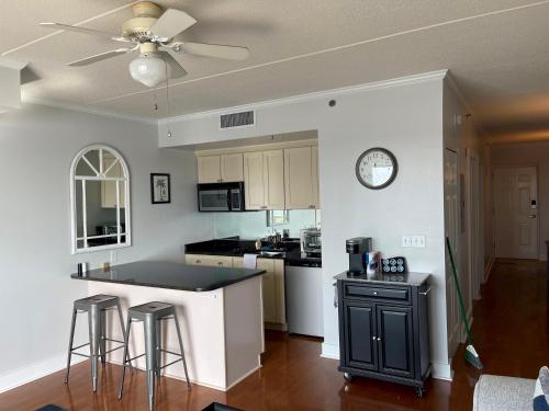 a kitchen with a ceiling fan and a counter top at Water Street Retreat 04 in Wilmington