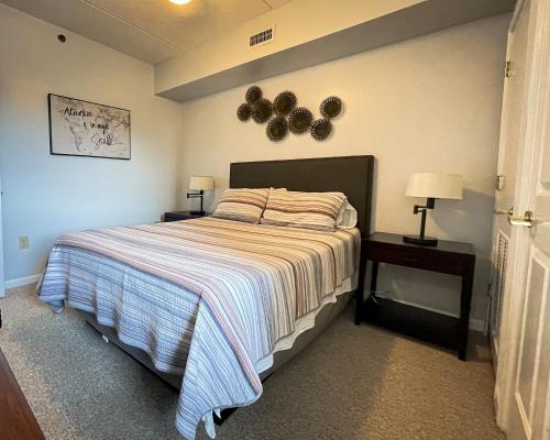 a bedroom with a large bed and two night stands at Water Street Retreat 05 in Wilmington