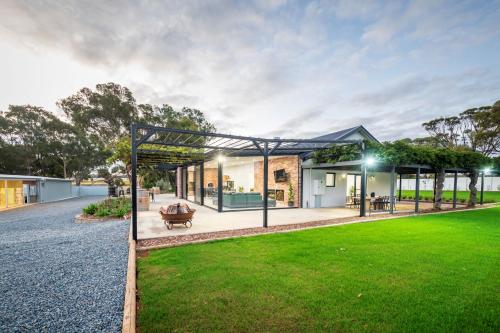 a house with a glass extension with a lawn at CASALE ESTATE in Nuriootpa
