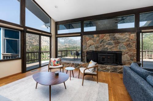 a living room with a couch and a fireplace at Mountain View, Hot Tub, Open Kitchen, 10m to Sequoia in Three Rivers