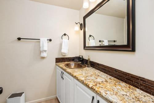 a bathroom with a sink and a mirror at Mountain View, Hot Tub, Open Kitchen, 10m to Sequoia in Three Rivers