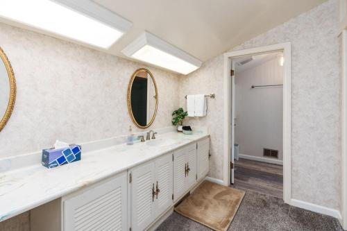 a bathroom with a sink and a mirror at Mountain View, Hot Tub, Open Kitchen, 10m to Sequoia in Three Rivers