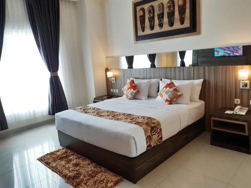 Giường trong phòng chung tại Vega Prime Hotel & Convention