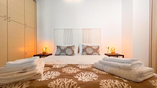 Giường trong phòng chung tại Oidu - Cagliari Suites