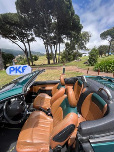 a car with brown seats in a park at Apartamentos do Mar Funchal in Funchal