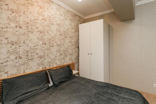 Postel nebo postele na pokoji v ubytování City Center Lev Tolstoi Residence