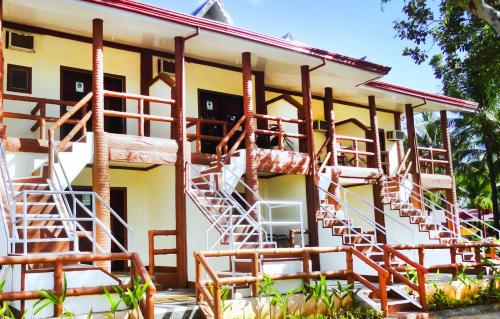 a building with lots ofadders on the side of it at Bakasyunan Resort and Conference Center - Zambales in Iba