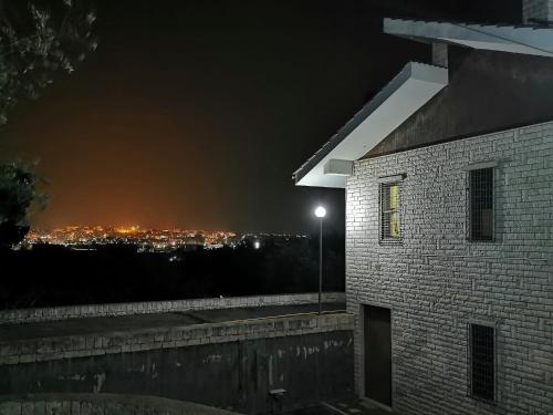 a night view of a city with a street light at Happy's Casa in Putignano
