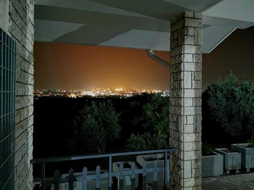 a view from the balcony of a house at night at Happy's Casa in Putignano