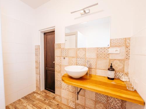 a bathroom with a sink and a mirror at Penzion Labská Vyhlídka in Litoměřice