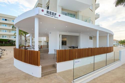 a rendering of the reception of a hotel with a building at Sunrise Oasis Hotel & Waterpark in Protaras