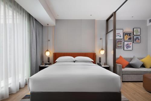 Ένα ή περισσότερα κρεβάτια σε δωμάτιο στο Home2 Suites By Hilton Wuhan Xudong