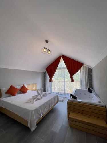 Postel nebo postele na pokoji v ubytování Villa Meşedibi