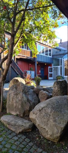 a group of large rocks in front of a building at Vertshuset Røros in Røros