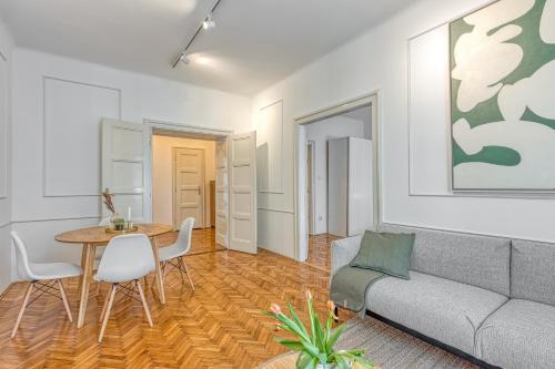 a living room with a couch and a table at Spacious Apartment In Heart Of Zagreb - Happy Rentals in Zagreb