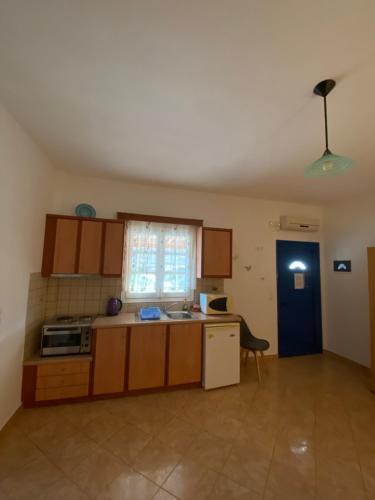 a kitchen with a sink and a stove top oven at Dream Catcher 5 in Agia Theodoti