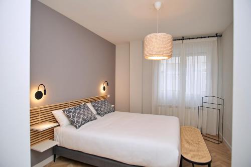 Ένα ή περισσότερα κρεβάτια σε δωμάτιο στο Apartamentos Los Arroyos