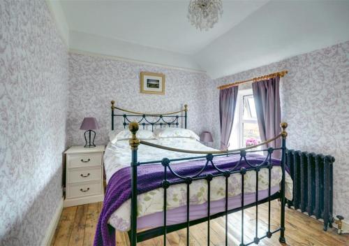 Katil atau katil-katil dalam bilik di Lavender Cottage