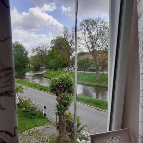 a view of a river from a window at Bi uns im Norden in Brunsbüttel