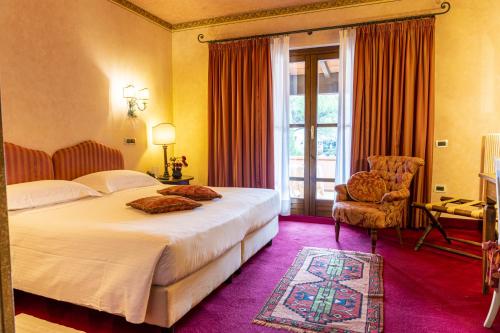 Postel nebo postele na pokoji v ubytování Hotel Boccaccio