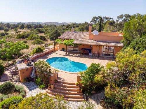 an aerial view of a house with a swimming pool at Quinta Tannamara villa private pool & garden in Burgau