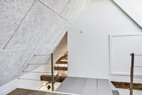 a staircase in a white room with a white wall at Amazing Home In Løkken With 2 Bedrooms in Løkken