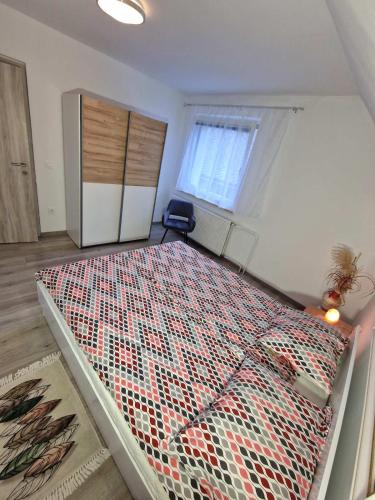 a bedroom with a large bed in a room at Apartments Karin in Bled