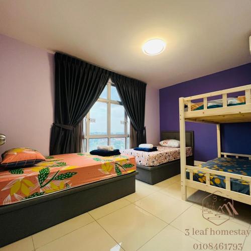a bedroom with two bunk beds and a window at KULAI IOI MALL D'Putra Suites Near JPO Senai Airport in Kampong Saleng