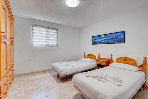 Postel nebo postele na pokoji v ubytování Island Sun