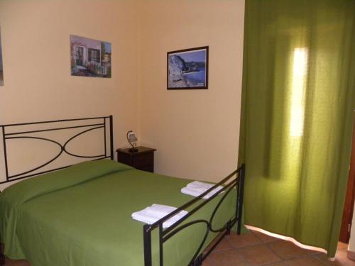 A bed or beds in a room at Case Vacanze Albamarina