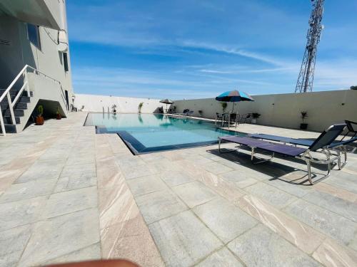 a swimming pool on the roof of a building at VITS Jamnagar in Jamnagar