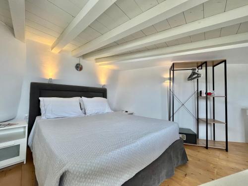 a bedroom with a large bed in a room at Crystal Suites in Mýkonos City