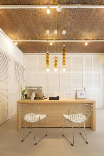 an office with two chairs and a desk with a computer at Cabot Romantic- Adults Only in Port de Pollensa