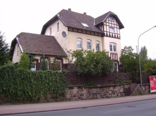 a large house on the side of a street at Schönes Zimmer im Seterant/Untergeschoss in Essen