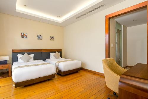 Ένα ή περισσότερα κρεβάτια σε δωμάτιο στο Ocean Sunny Villas Da Nang