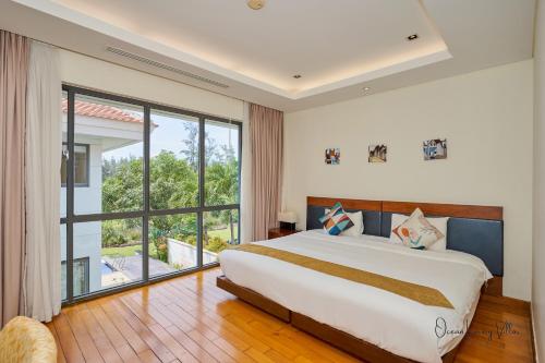 Ένα ή περισσότερα κρεβάτια σε δωμάτιο στο Ocean Sunny Villas Da Nang