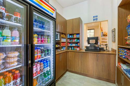 a refrigerator filled with lots of different types of drinks at Best Western Plus Miami Executive Airport Hotel and Suites in Kendall