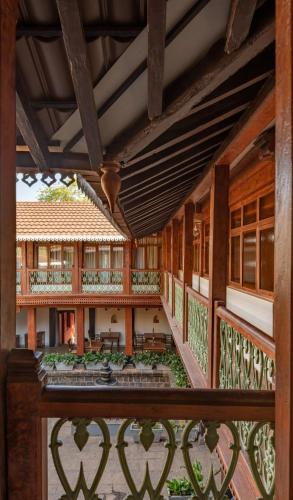 a view of the balcony of a house at Sawantwadi Palace Boutique Art Hotel in Sawantwadi