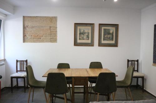 a dining room with a wooden table and chairs at CASA DA ALAMEDA in Nisa