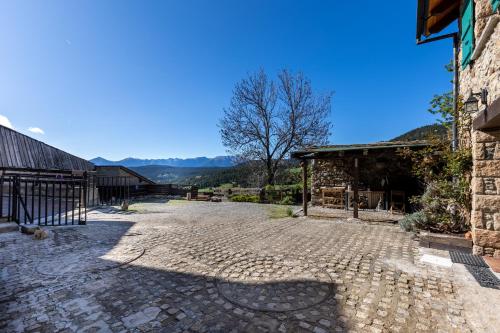 a cobblestone street in front of a building at La Grange de Cassiopée - Duplex avec vue imprenable in Les Angles