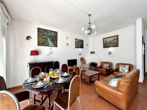 a living room with a table and a couch at Armação de Pêra Twins 3 by Homing in Armação de Pêra