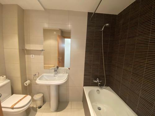 a bathroom with a sink and a tub and a toilet at Canillo L'Areny View HUT - 7775 in Canillo