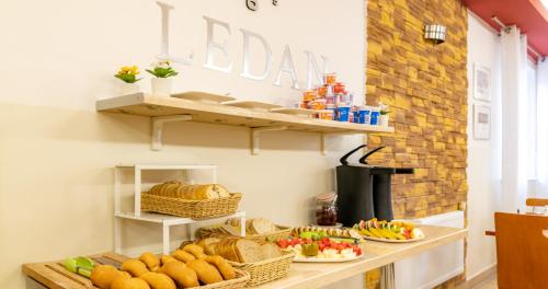 a table with baskets of food and bread on it at Ledan in Chłopy