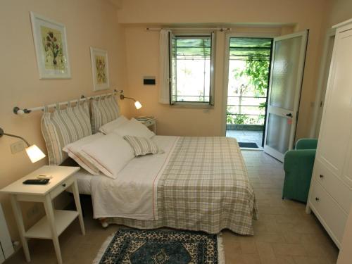 Ένα ή περισσότερα κρεβάτια σε δωμάτιο στο Agriturismo Peretti