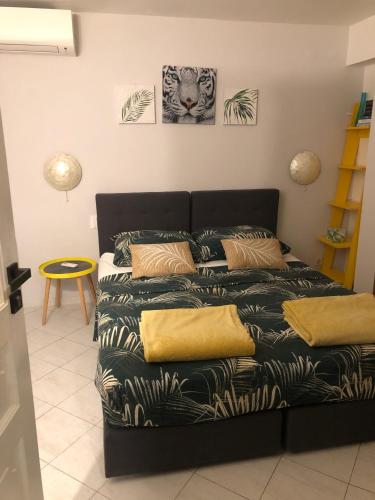 a couch in a living room with a bed at Flower House - Lapad in Dubrovnik