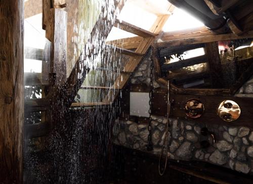 an overhead view of a room with rain on the ceiling at Naturerlebnis Suite - Nationalpark in Ramsau
