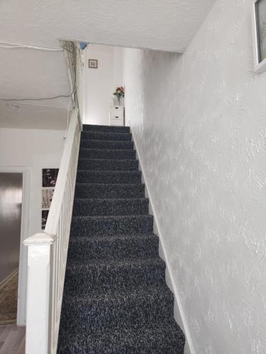 a stair case in a building with a staircase at Private Room in Ilford