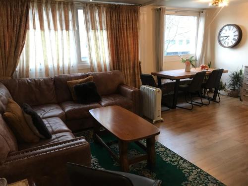 a living room with a couch and a table at Stoddart House in Newcastle upon Tyne